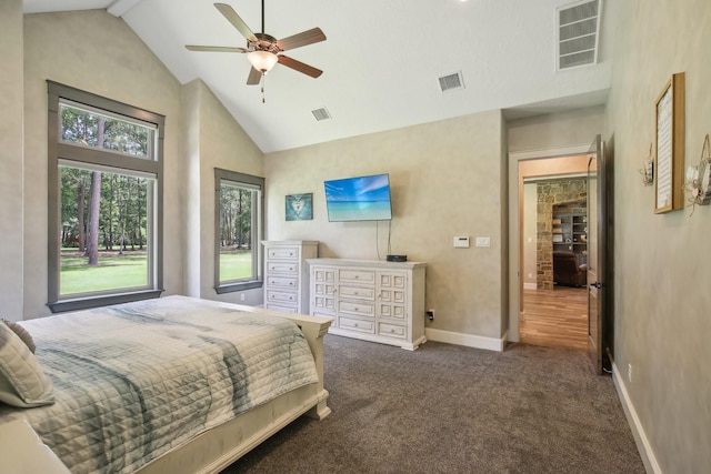 bedroom featuring high vaulted ceiling, baseboards, visible vents, and dark carpet