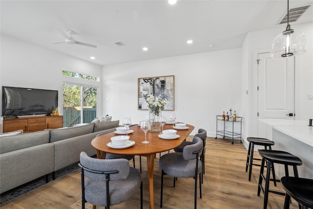 dining area with a ceiling fan, light wood-type flooring, visible vents, and recessed lighting