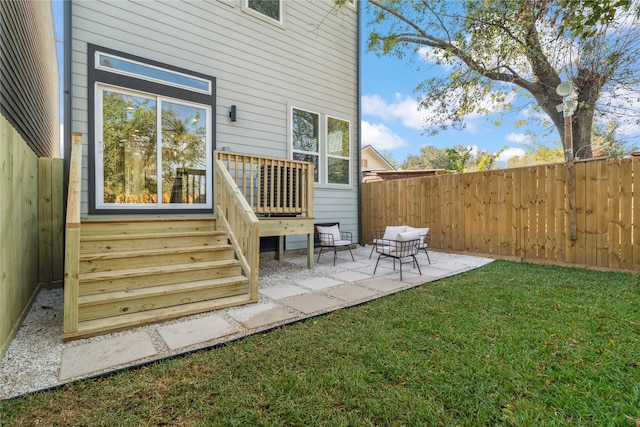 exterior space with a patio, a lawn, and fence