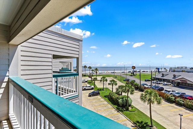 balcony featuring a water view