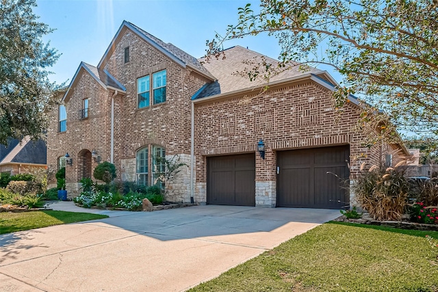 traditional-style house with brick siding, a shingled roof, a garage, stone siding, and driveway