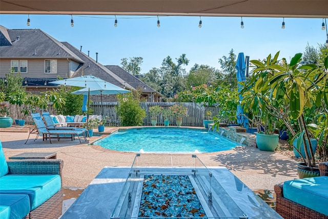 view of pool with a fenced in pool, a patio area, a fenced backyard, and an outdoor hangout area