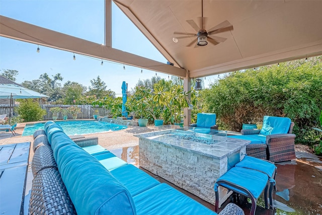 view of patio with a fenced in pool, an outdoor living space with a fire pit, ceiling fan, and a fenced backyard