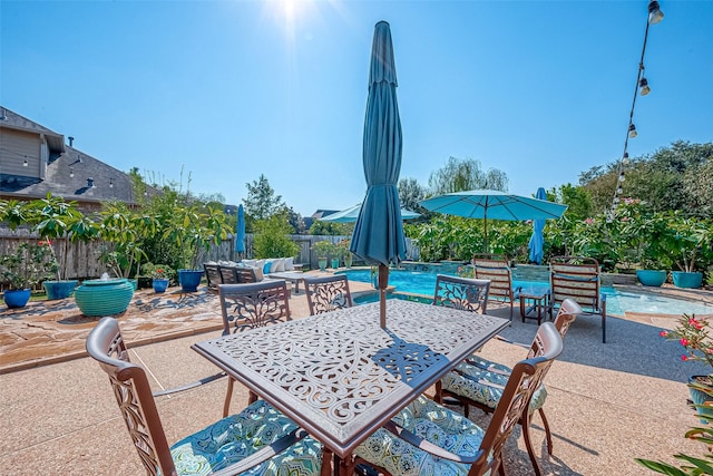 view of patio / terrace featuring outdoor dining space and a fenced backyard