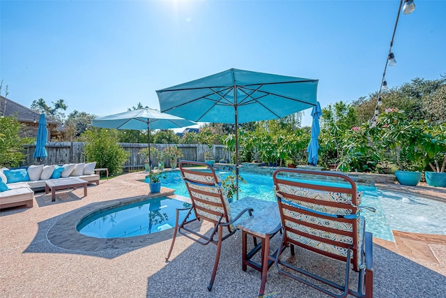 view of swimming pool featuring a fenced in pool, a patio area, a fenced backyard, and an outdoor hangout area