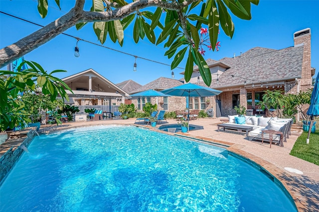 view of swimming pool with a fenced in pool, a patio, and an outdoor hangout area