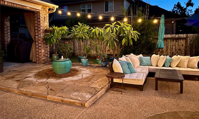 view of patio / terrace with an outdoor hangout area and fence