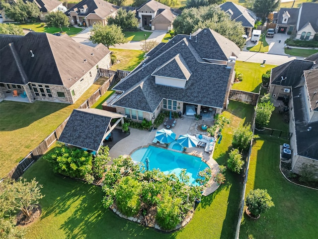 birds eye view of property with a residential view