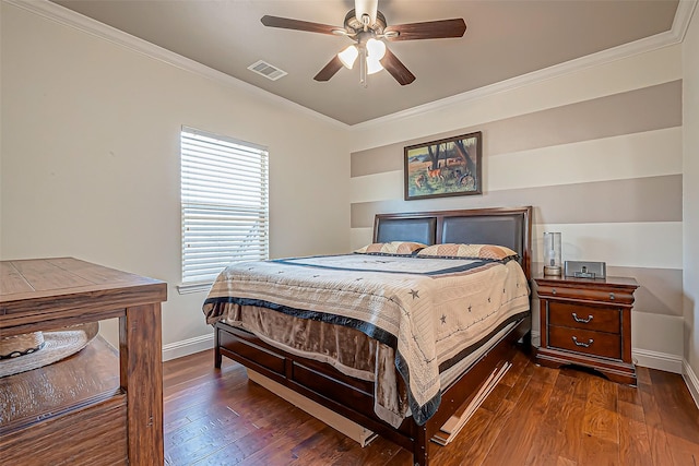 bedroom with baseboards, wood-type flooring, visible vents, and crown molding