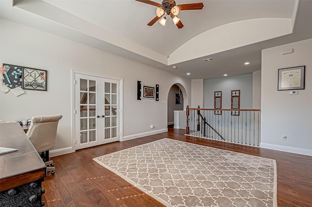 office space with baseboards, arched walkways, wood finished floors, and french doors