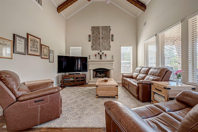 living room with a fireplace with raised hearth, high vaulted ceiling, beam ceiling, and visible vents