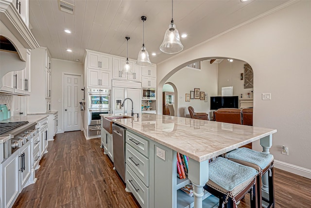 kitchen with arched walkways, wood ceiling, visible vents, and white cabinets