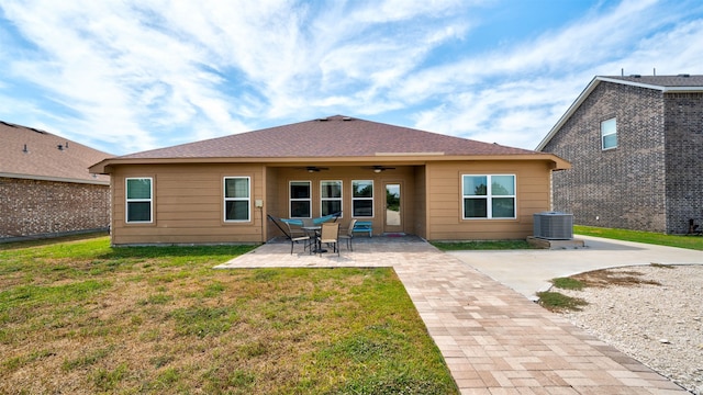 back of house with a ceiling fan, a patio area, a lawn, and central air condition unit