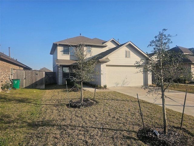 traditional-style home with driveway, brick siding, an attached garage, fence, and a front yard