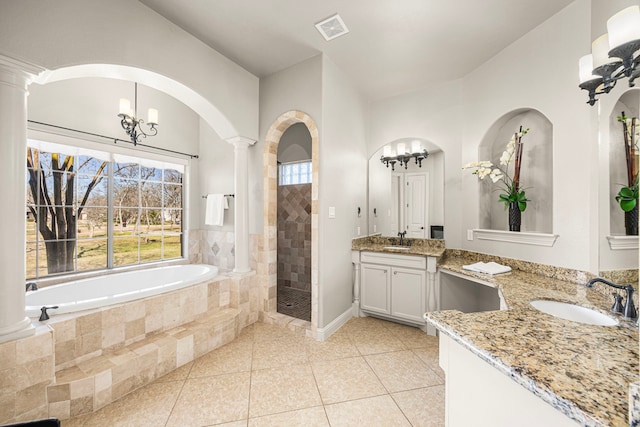 full bath featuring visible vents, a tile shower, tile patterned flooring, ornate columns, and a bath