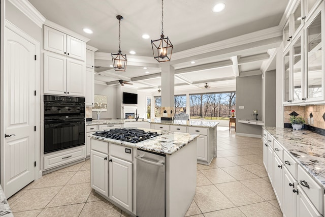 kitchen featuring a kitchen island, ceiling fan, black appliances, and light tile patterned floors