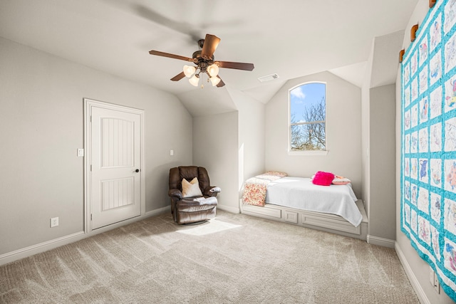 unfurnished bedroom with carpet floors, lofted ceiling, visible vents, ceiling fan, and baseboards