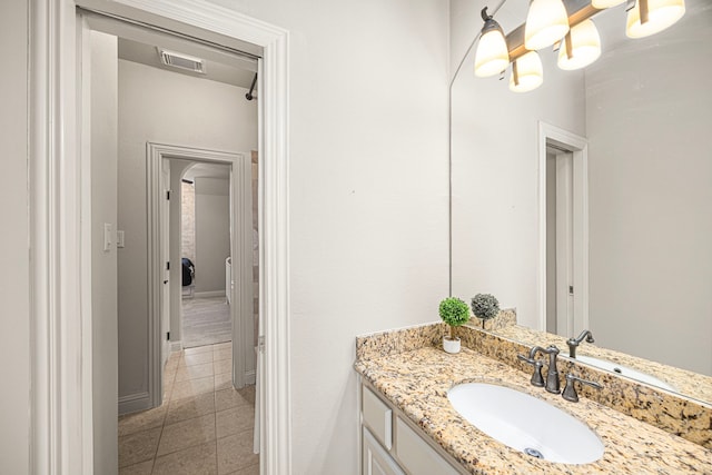 bathroom featuring vanity, visible vents, and tile patterned floors