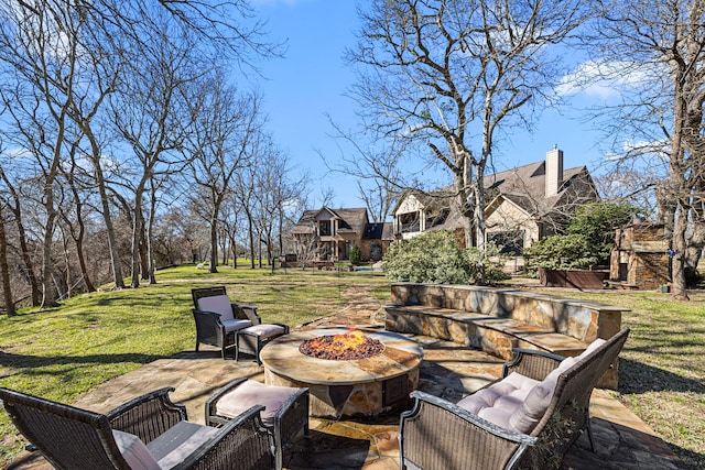 view of patio / terrace featuring an outdoor fire pit