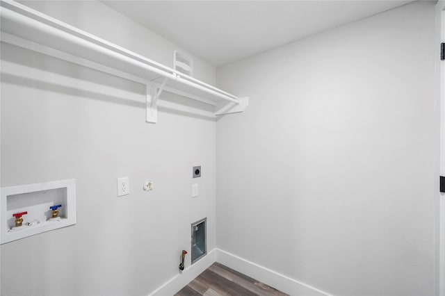 laundry area featuring gas dryer hookup, hookup for an electric dryer, laundry area, washer hookup, and baseboards