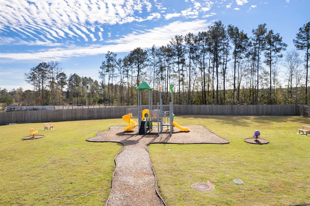 view of yard featuring a playground and a fenced backyard