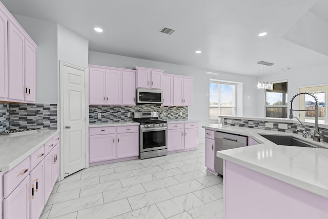 kitchen featuring stainless steel appliances, a sink, visible vents, marble finish floor, and light countertops