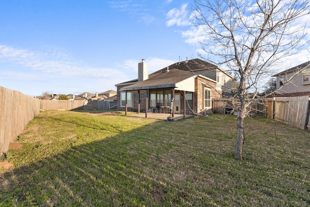 view of yard with a fenced backyard and a patio area