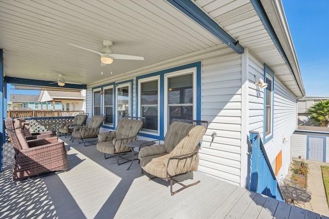 deck with ceiling fan and an outdoor hangout area