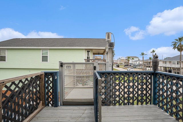 wooden terrace featuring a residential view