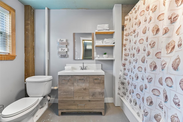 full bath featuring finished concrete floors, curtained shower, vanity, and toilet