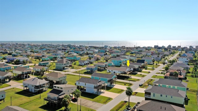 drone / aerial view featuring a residential view and a water view