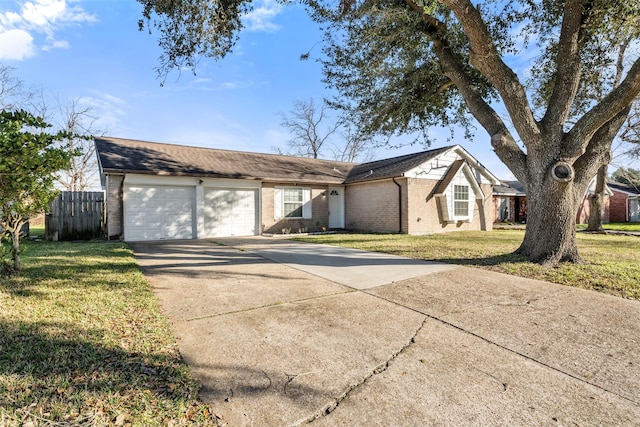 single story home featuring brick siding, an attached garage, and a front lawn