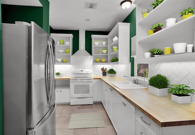 kitchen with open shelves, white cabinetry, a sink, wood counters, and white appliances