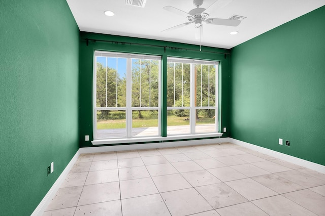 spare room with ceiling fan, recessed lighting, visible vents, and baseboards