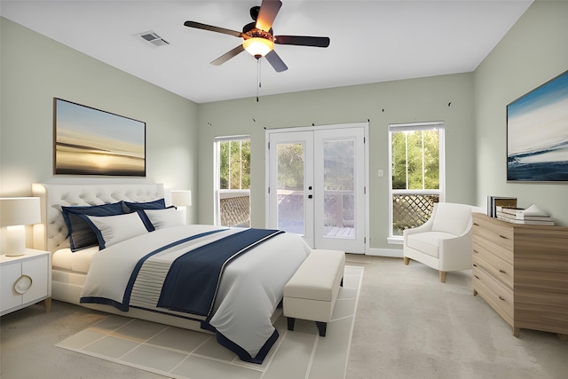 bedroom featuring access to exterior, french doors, visible vents, a ceiling fan, and light carpet