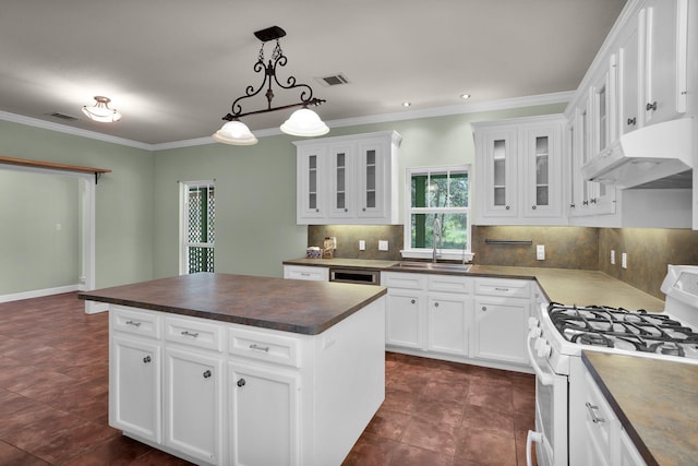 kitchen with under cabinet range hood, white gas range, a kitchen island, and white cabinets