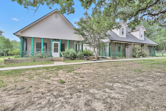 view of front of house featuring a sunroom