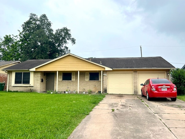 single story home with a garage, brick siding, driveway, and a front lawn