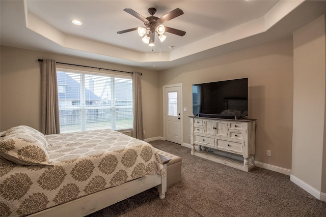 bedroom featuring baseboards, ceiling fan, a tray ceiling, carpet floors, and recessed lighting