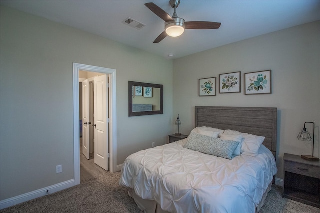 bedroom with a ceiling fan, carpet flooring, visible vents, and baseboards