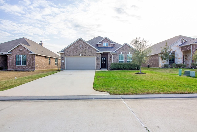 view of front of property featuring a garage, brick siding, concrete driveway, and a front yard