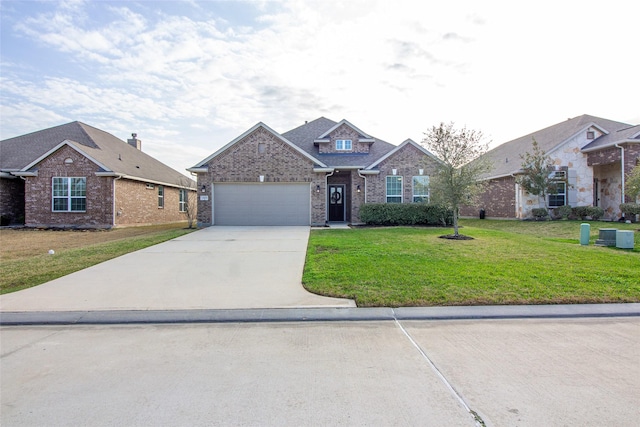 view of front of house with driveway, a front lawn, an attached garage, and brick siding