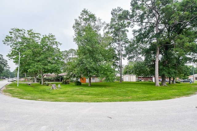 2626 Druid St, Houston, TX 77091 - view of community with a lawn, a shed, and an outbuilding