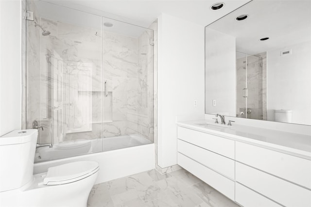 full bathroom with enclosed tub / shower combo, toilet, visible vents, vanity, and marble finish floor