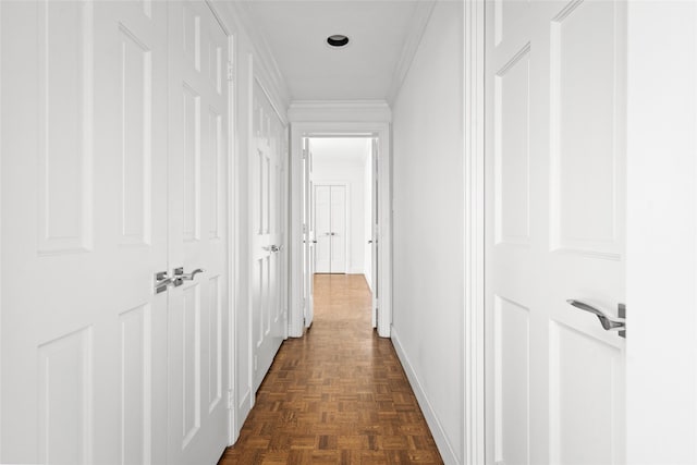 hallway featuring baseboards and ornamental molding