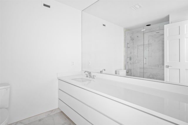 bathroom featuring toilet, marble finish floor, visible vents, and vanity