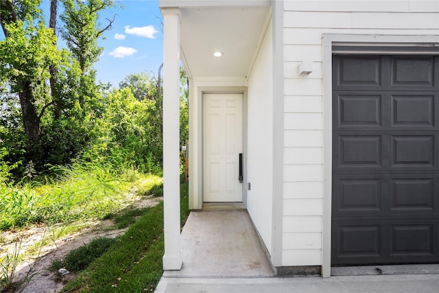 doorway to property featuring a garage