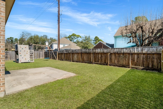 view of yard with a fenced backyard and a patio