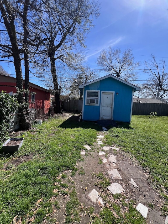 view of yard featuring an outbuilding and a fenced backyard