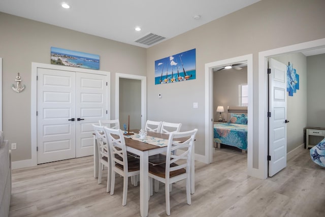 dining space with light wood finished floors, baseboards, visible vents, and recessed lighting